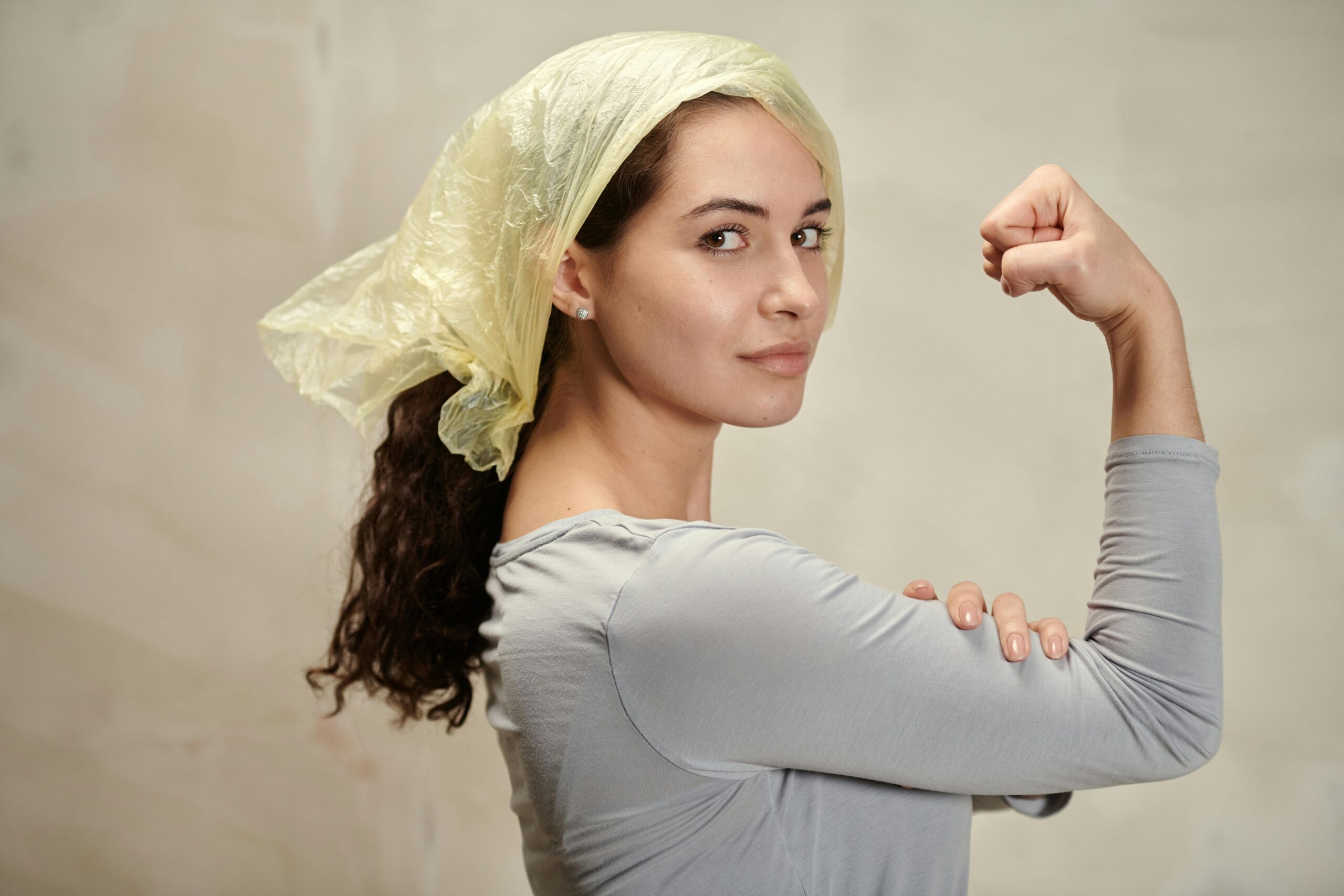 A confident woman shows that she is strong